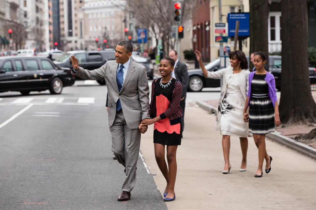 President Barack Obama and First Lady Michelle Obama walk with their daughters Sasha and Malia, right, to attend an Easter service at St. John's Church in Washington, D.C., Sunday, March 31, 2013. 