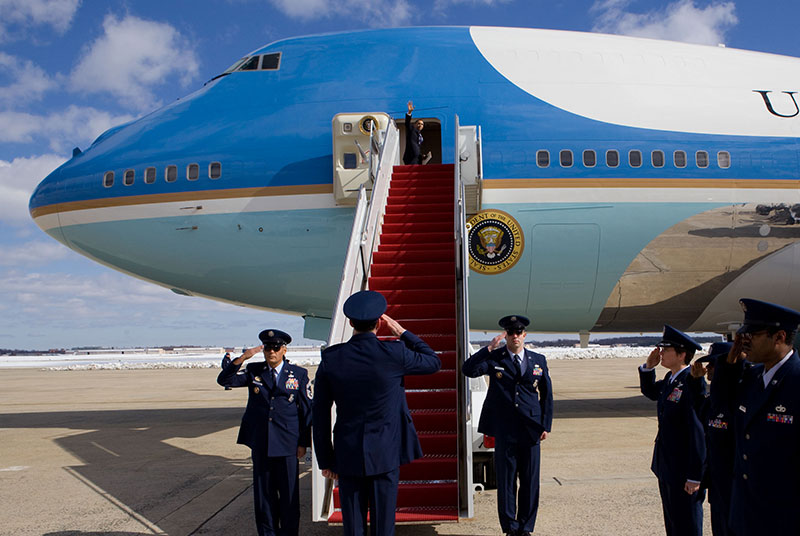 President Barack Obama is saluted by Air Force members as he waves from Air Force One prior to departing from Andrews Air Force Base en route to Denver, Colo., Feb. 18, 2010. (P021810PS-0464)