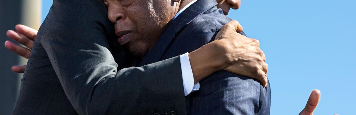 President Barack Obama hugs Rep. John Lewis, D-Ga., after his introduction during the event to commemorate the 50th Anniversary of Bloody Sunday and the Selma to Montgomery civil rights marches, at the Edmund Pettus Bridge in Selma, Ala., March 7, 2015.