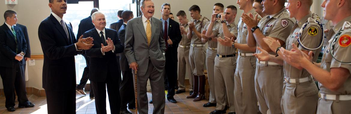 President Barack Obama, former President George H. W. Bush and Defense Secretary Robert Gates greet Marine Corps cadets in the Marine Corps Mess Hall at Texas A&M University, in College Station, Texas, Oct. 16, 2009