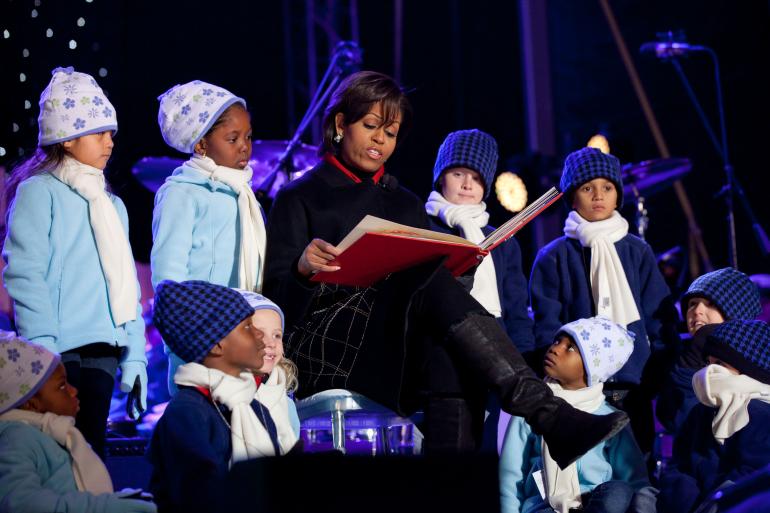 First Lady Michelle Obama reads “‘Twas the Night Before Christmas” at the National Christmas Tree Lighting Ceremony on the Ellipse in Washington, D.C., December 9, 2010.