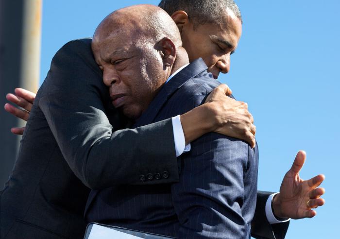 President Barack Obama hugs Rep. John Lewis, D-Ga., after his introduction during the event to commemorate the 50th Anniversary of Bloody Sunday and the Selma to Montgomery civil rights marches, at the Edmund Pettus Bridge in Selma, Ala., March 7, 2015.