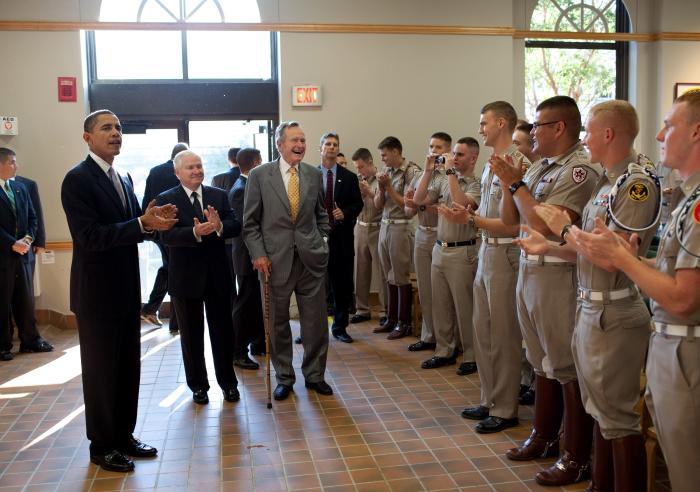 President Barack Obama, former President George H. W. Bush and Defense Secretary Robert Gates greet Marine Corps cadets in the Marine Corps Mess Hall at Texas A&M University, in College Station, Texas, Oct. 16, 2009