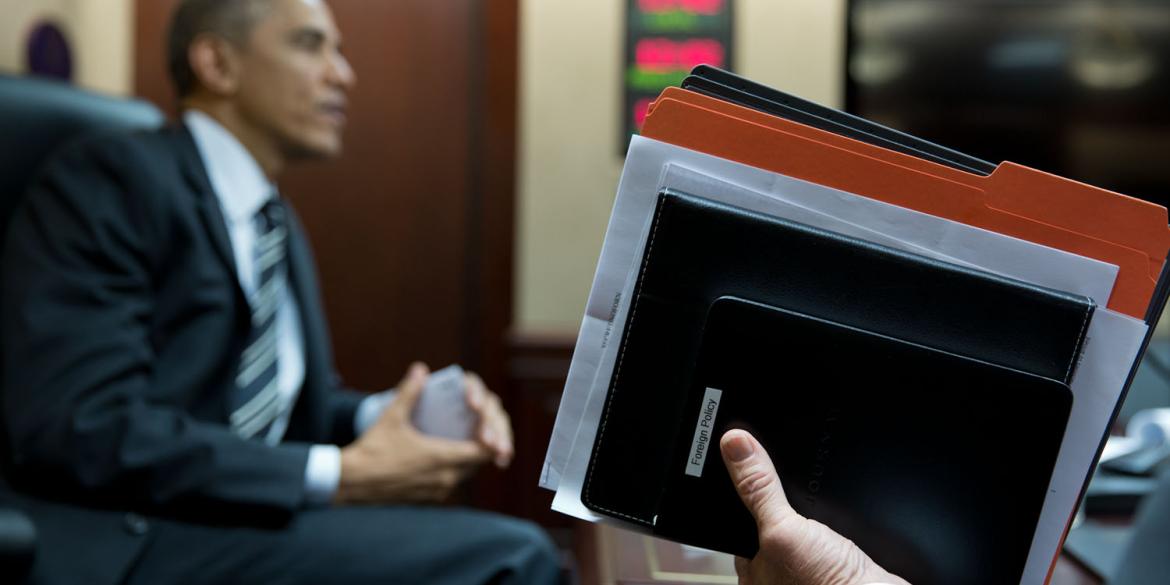 Vice President Joe Biden holds a briefing book and assorted folder at the conclusion of a meeting in the Situation Room.