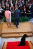 President Barack Obama is joined by First Lady Michelle Obama and Bo, the Obama family dog, as he delivers remarks during a Christmas holiday reception in the Grand Foyer of the White House, December 15, 2010. 