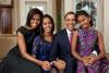 President Barack Obama, First Lady Michelle Obama, and their daughters, Malia, left, and Sasha, right, sit for a family portrait in the Oval Office, December 11, 2011.