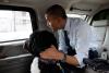 President Barack Obama and Bo, the Obama family dog, ride in the presidential limousine en route to PetSmart in Alexandria, Virginia, December 21, 2011. 