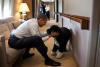 President Barack Obama plays with Bo, the Obama family dog, aboard Air Force One during a flight to Hawaii, December 23, 2011. 