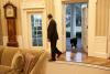 President Barack Obama looks back as Bo, the Obama family dog, follows him into the Oval Office, January 27, 2012. 