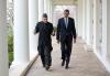 President Barack Obama and President Hamid Karzai of Afghanistan walk on the Colonnade of the White House following their meeting in the Oval Office, January 11, 2013. 