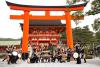 First Lady Michelle Obama joins Taiko drummers at center drum prior to a tour of the Fushimi Inari Shinto Shrine in Kyoto, Japan, March 20, 2015.