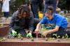 First Lady Michelle Obama joins FoodCorps leaders and local students for the spring planting in the White House Kitchen Garden, April 2, 2014.