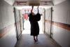 First Lady Michelle Obama touches the Hokie Stone before walking onto the field at Lane Stadium to give the Virginia Tech commencement address in Blacksburg, Virginia, May 11, 2012.
