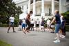 First Lady Michelle Obama and kids double-dutch jump rope during a taping for the Presidential Active Lifestyle Award (PALA) challenge and Nickelodeon's Worldwide Day of Play, on the South Lawn of the White House, July 15, 2011. 