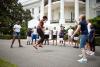 First Lady Michelle Obama and kids double-dutch jump rope during a taping for the Presidential Active Lifestyle Award (PALA) challenge and Nickelodeon's Worldwide Day of Play, on the South Lawn of the White House, July 15, 2011.
