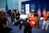 First Lady Michelle Obama is picked up by U.S. Olympic wrestler Elena Pirozhkova during a greet with Team USA Olympic athletes competing in the 2012 Summer Olympic Games, at the U.S. Olympic Training Facility at the University of East London in London, En