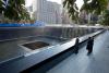 President Barack Obama and First Lady Michelle Obama, along with former President George W. Bush and former First Lady Laura Bush, pause at the North Memorial Pool of the National September 11 Memorial in New York, New York, on the tenth anniversary of th