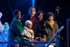 President Barack Obama, with mother-in-law Marian Robinson, daughters Sasha and Malia, and First Lady Michelle Obama, react as they push the button to light the National Christmas Tree during a ceremony on the Ellipse in Washington, D.C., December 9, 2010