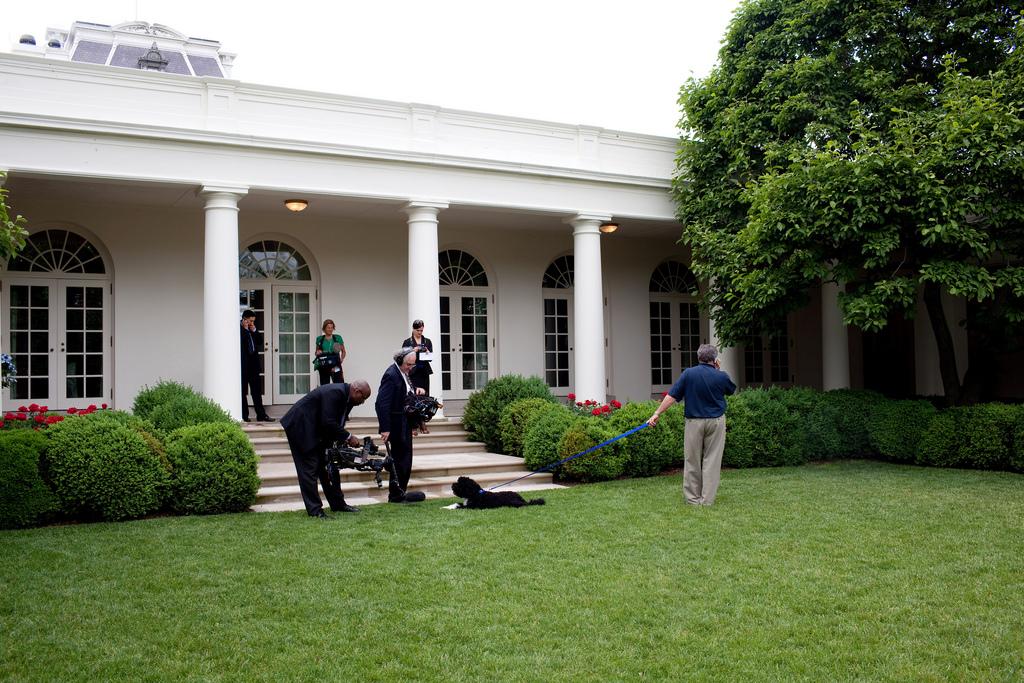 NBC video and sound crews capture footage of the "First Dog" in the Rose Garden outside the Oval Office for their prime-time broadcast "Inside the Obama White House," May 29, 2009.
