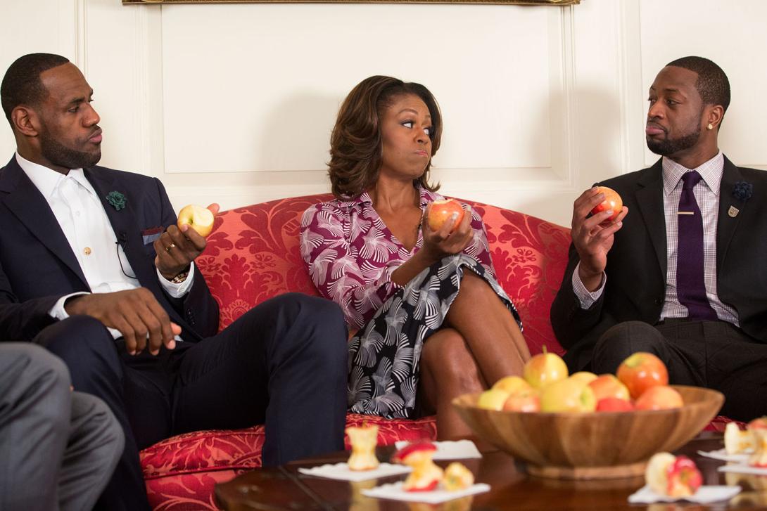 First Lady Michelle Obama tapes a "Let's Move!" public service announcement with 2013 NBA Champion Miami Heat players LeBron James, left, and Dwyane Wade, in the Map Room of the White House, January 14, 2014.