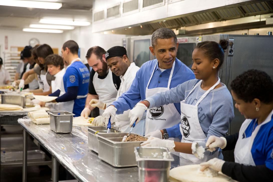 President Barack Obama and his daughter Sasha assemble burritos during a Martin Luther King, Jr. Day of Service event at DC Central Kitchen in Washington, D.C., January 20, 2014