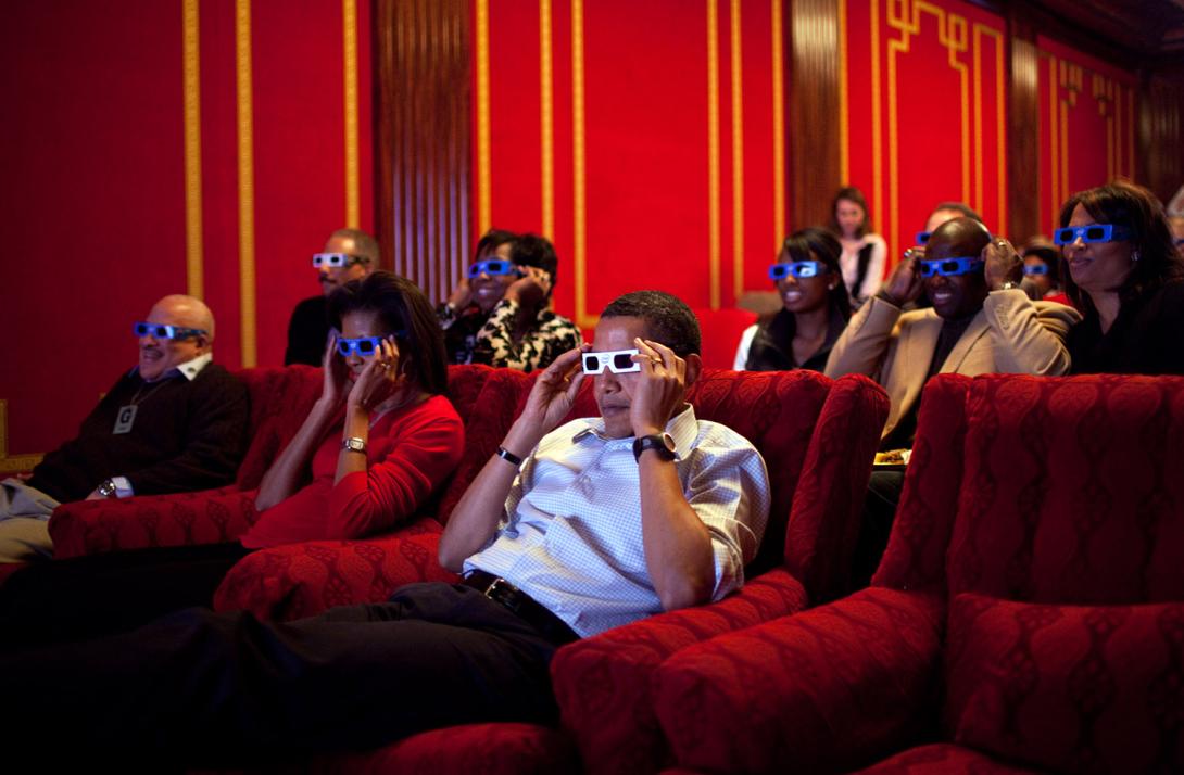 President Barack Obama and First Lady Michelle Obama wear 3-D glasses while watching a TV commercial during Super Bowl 43, Arizona Cardinals vs. Pittsburgh Steelers, in the family theater of the White House on February 1, 2009. Guests included family, fri