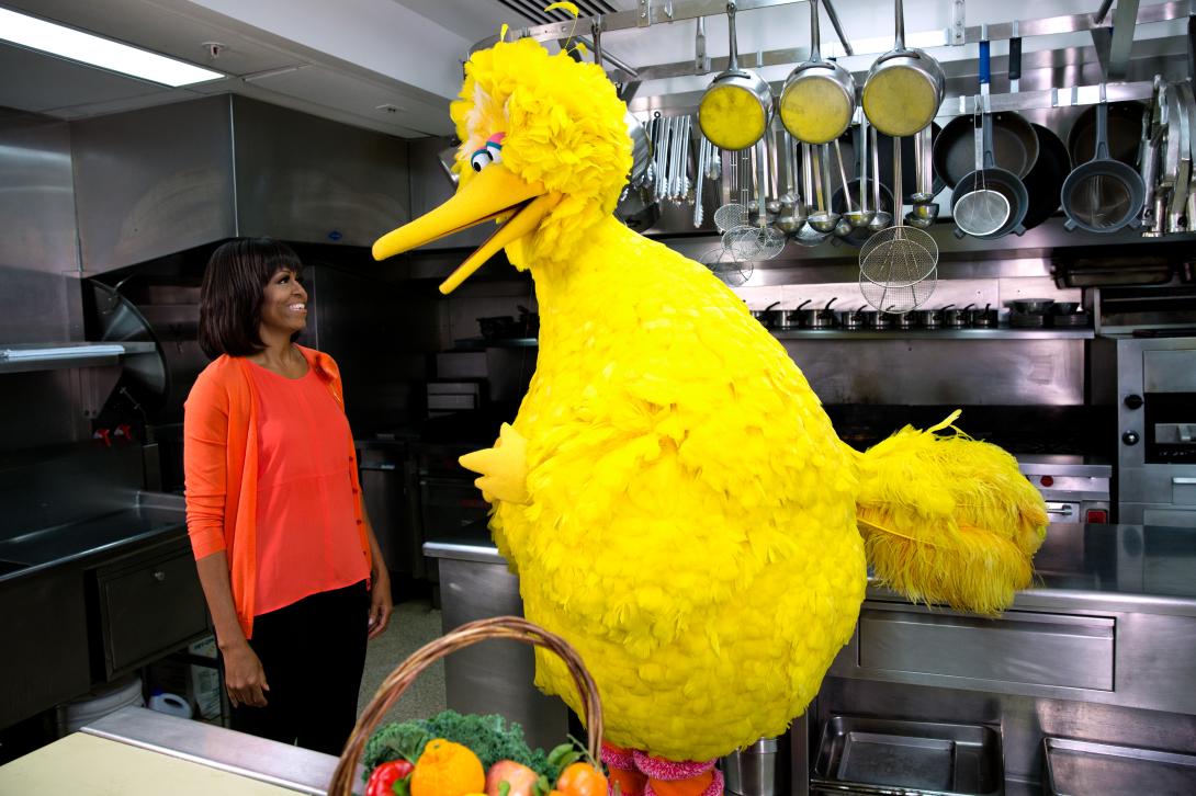 First Lady Michelle Obama participates in a “Let’s Move!” and "Sesame Street" public service announcement taping with Big Bird in the White House Kitchen, February 13, 2013.