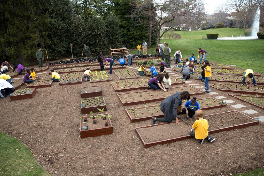 First Lady Michelle Obama joins FoodCorps leaders and local students for the spring garden planting in the White House Kitchen Garden, April 2, 2014. 