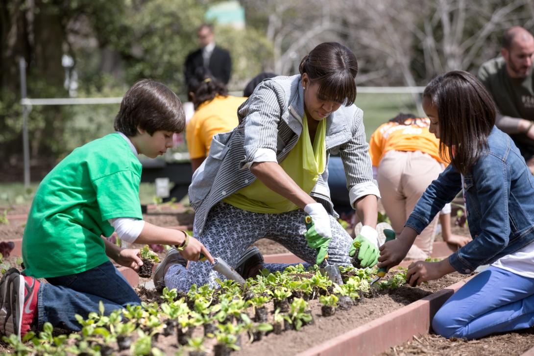 First Lady Michelle Obama and students from around the country participate in the White House Kitchen Garden spring planting on the South Lawn of the White House, April 4, 2013. Mrs. Obama was joined by students from Benjamin David Gullett Elementary Scho