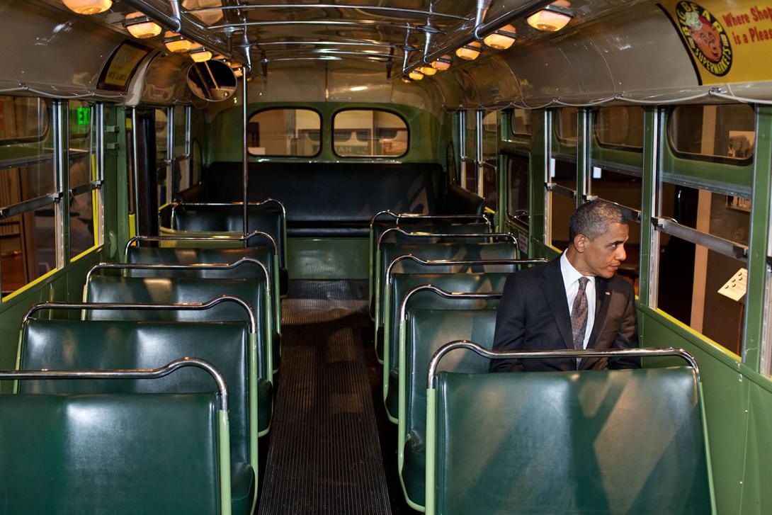 President Barack Obama sits on the famed Rosa Parks bus at the Henry Ford Museum following an event in Dearborn, Michigan, April 18, 2012. 