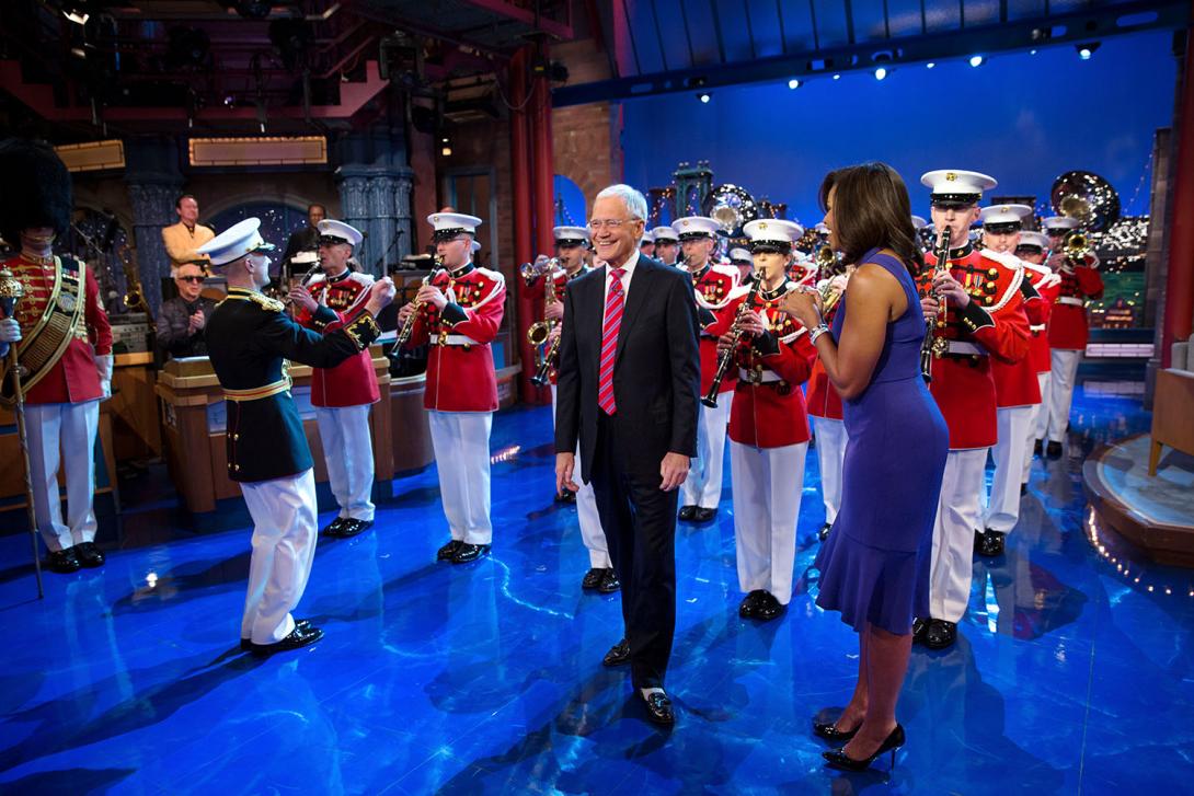 First Lady Michelle Obama surprises David Letterman with a performance by the United States Marine Band for “The Late Show with David Letterman” in New York City, April 30, 2015. 