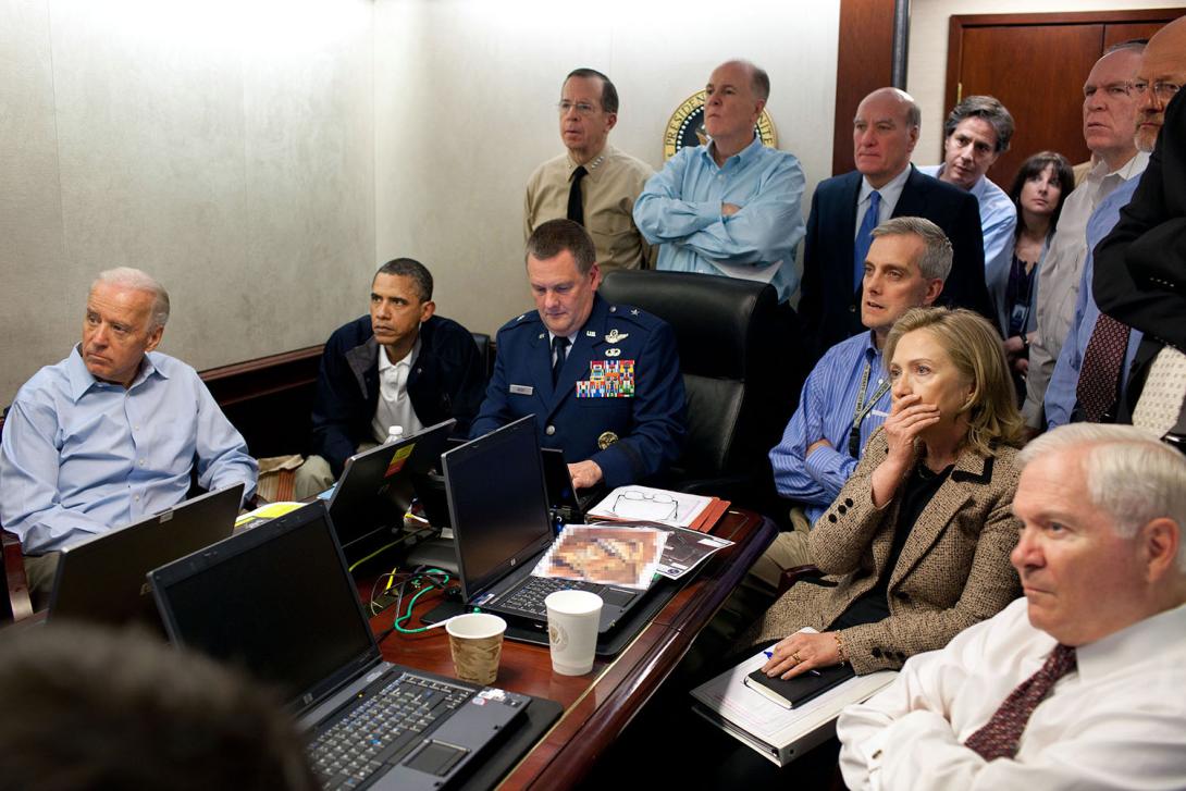 President Barack Obama and Vice President Joe Biden, along with members of the national security team, receive an update on the mission against Osama bin Laden in the Situation Room of the White House, May 1, 2011. Seated, from left, are: Brigadier Genera