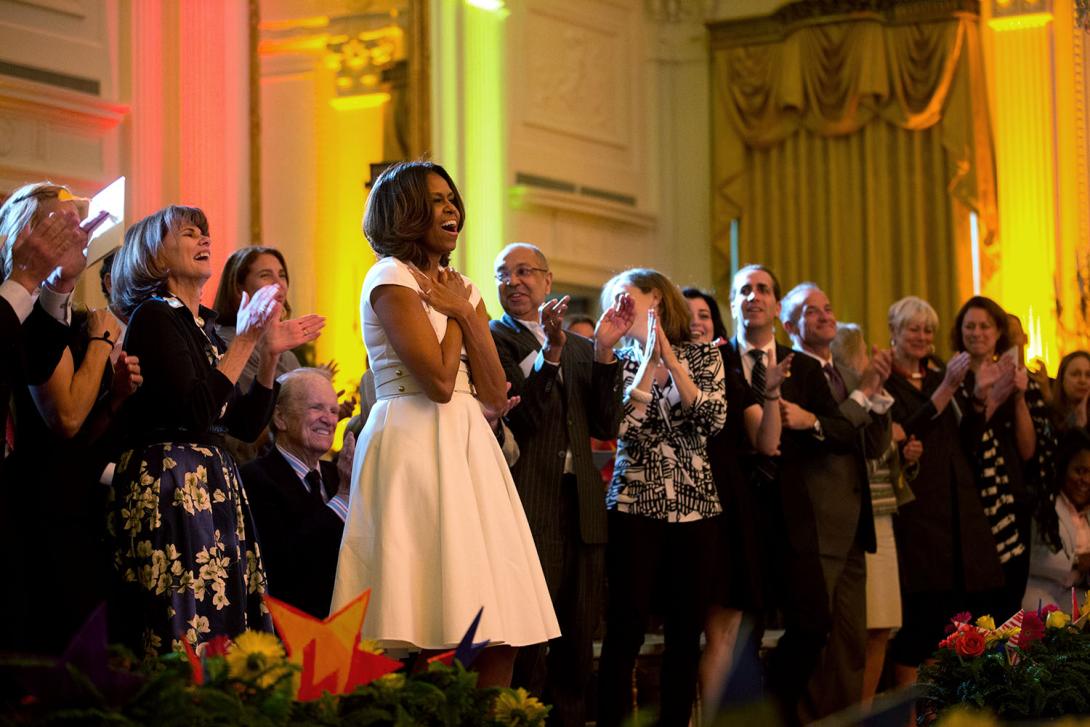 First Lady Michelle Obama and audience members show their appreciation for a performance during the White House Talent Show in the East Room of the White House, May 20, 2014. The event, hosted with the President's Committee on the Arts and the Humanities,