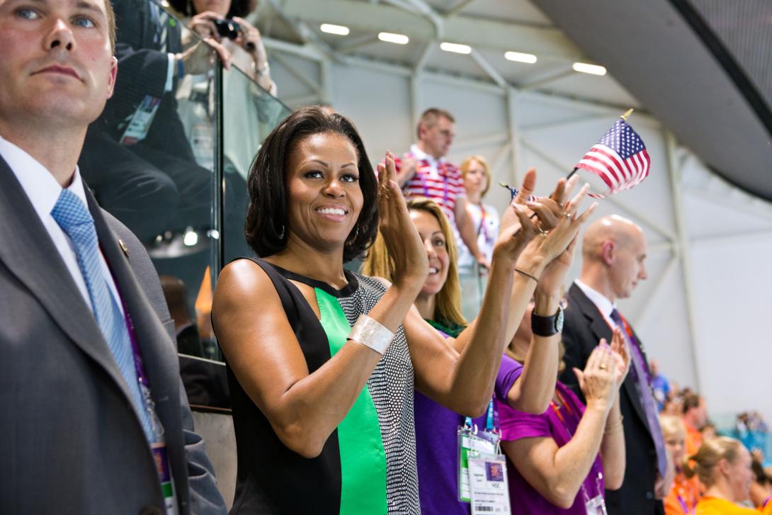 First Lady Michelle Obama watches the swimming finals and medal ceremonies at the Olympic Park Aquatics Center during the 2012 Summer Olympic Games in London, England, July 28, 2012.