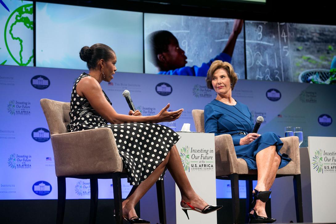 First Lady Michelle Obama and former First Lady Laura Bush participate in a symposium on advancement for women and girls in Africa, with U.S.-Africa Leaders Summit spouses at the John F. Kennedy Center for the Performing Arts in Washington, D.C., August 6