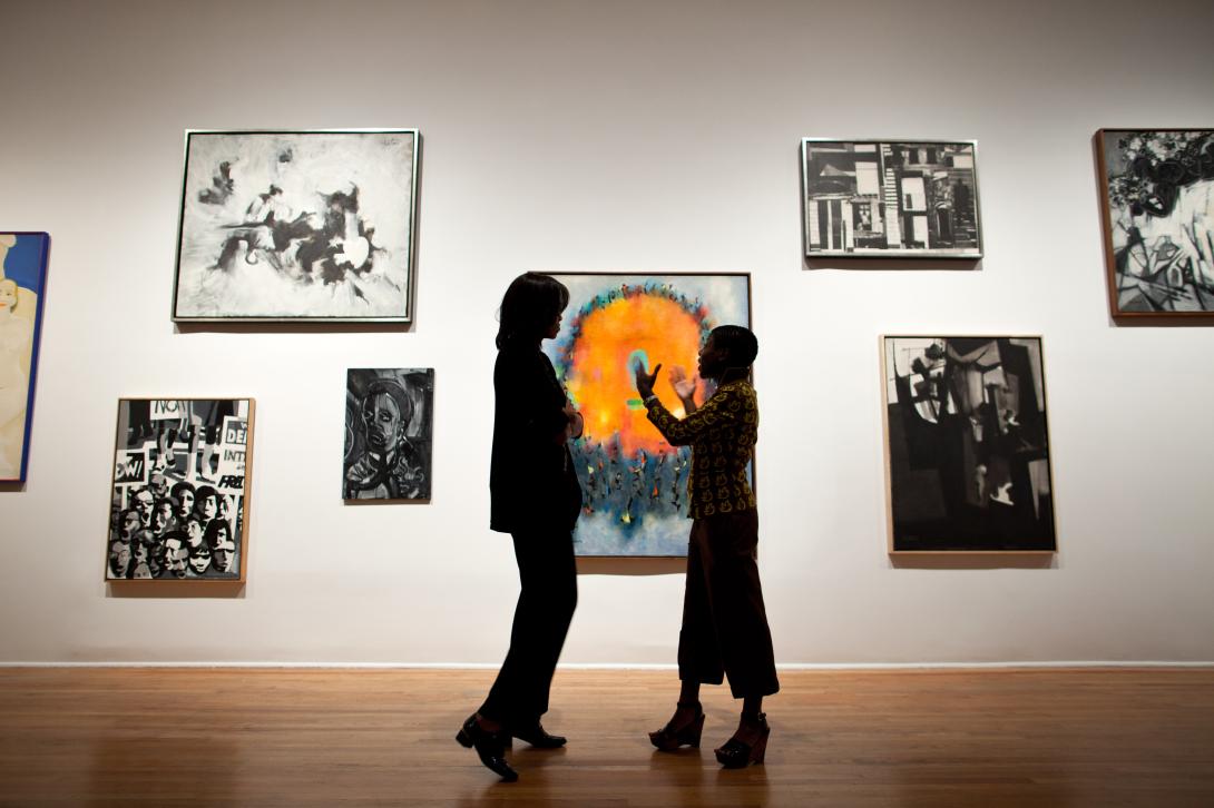 First Lady Michelle Obama talks with Director and Chief Curator Thelma Golden during a tour of the Studio Museum in Harlem, in New York, New York, September 21, 2011.