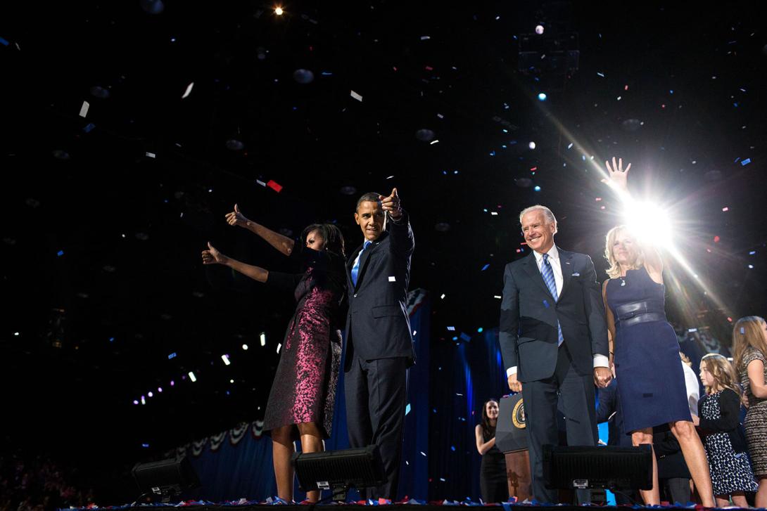 President Barack Obama, First Lady Michelle Obama, daughters Sasha and Malia, Vice President Joe Biden, Dr. Jill Biden, and the Biden family wave to the crowd as confetti rains down following the President's election night remarks at McCormick Place in Ch