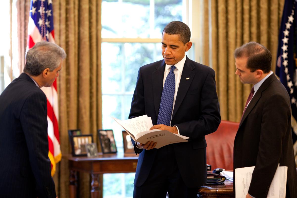 President Barack Obama reviews his remarks in the Oval Office with chief of staff Rahm Emanuel, left, and speechwriter Ben Rhodes on May 6, 2009.